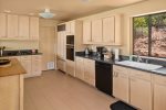 The fully-equipped kitchen boasts high-end appliances and amenities